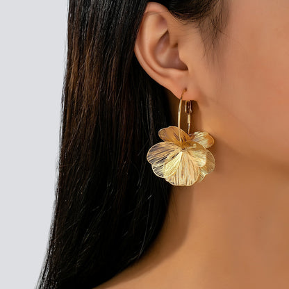 Boucles d'oreilles creuses en or exagérées