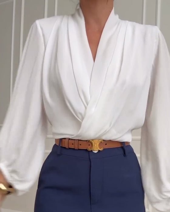 Blouse à manches bouffantes avec décolleté en V de couleur unie
