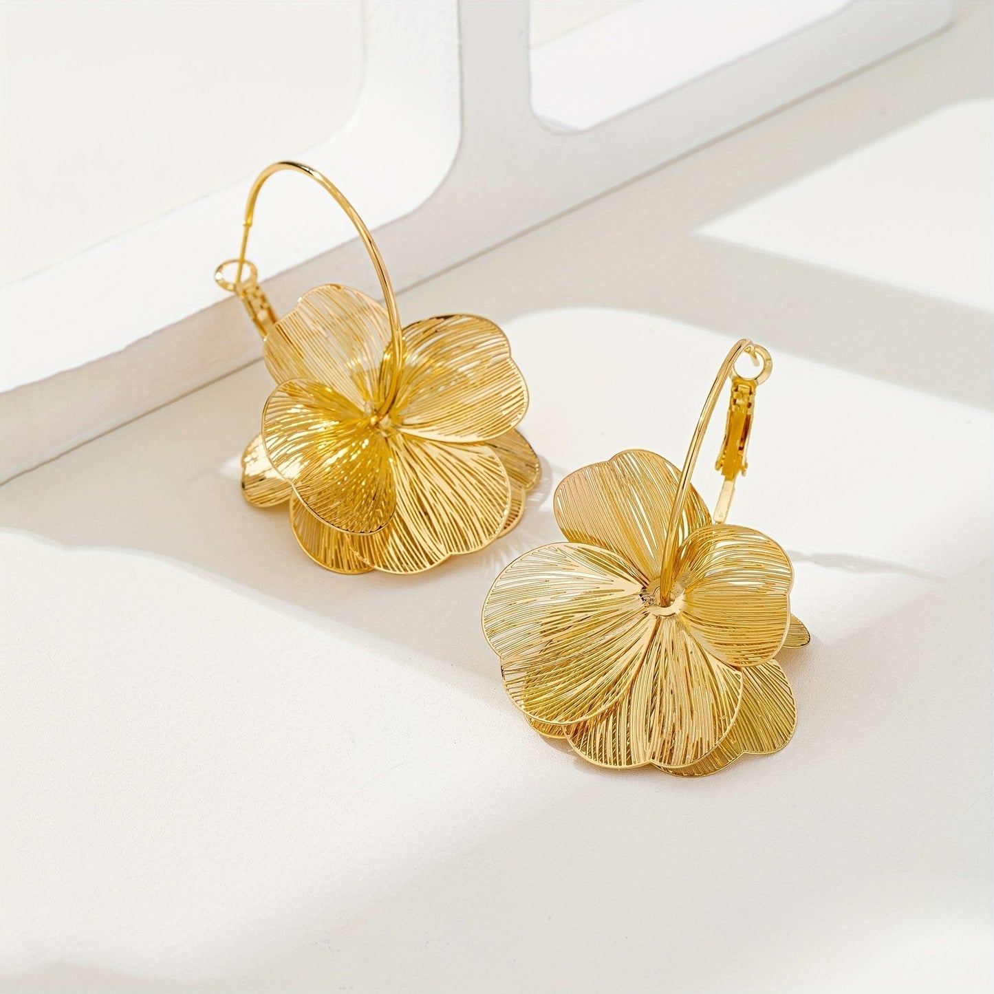 Boucles d'oreilles creuses en or exagérées