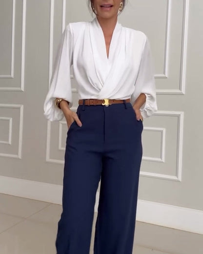 Blouse à manches bouffantes avec décolleté en V de couleur unie