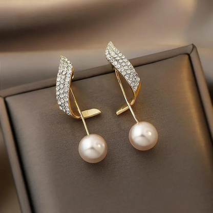 Boucles d'oreilles pendantes en perles dorées chic