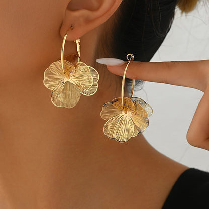 Boucles d'oreilles creuses en or exagérées