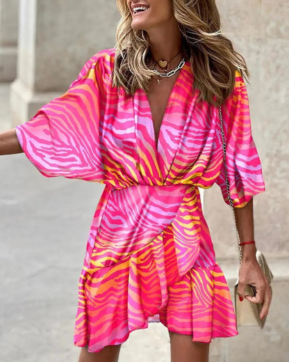 Niana - Robe élégante à décolleté en V et imprimé vivant