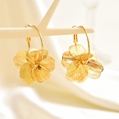 Boucles d'oreilles creuses en or exagérées
